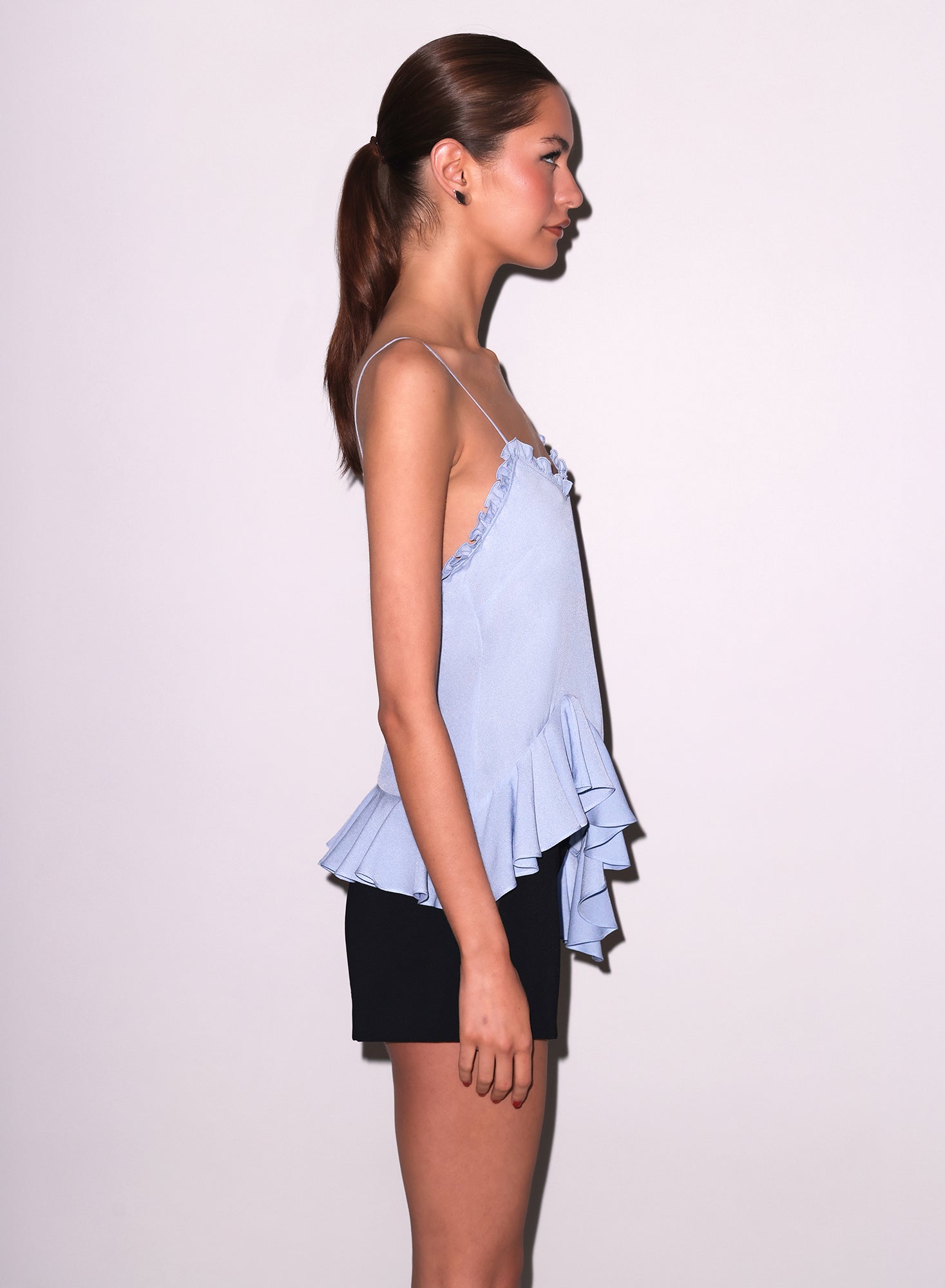 Side view of Victoria Top in blue with black Tuxedo Shorts