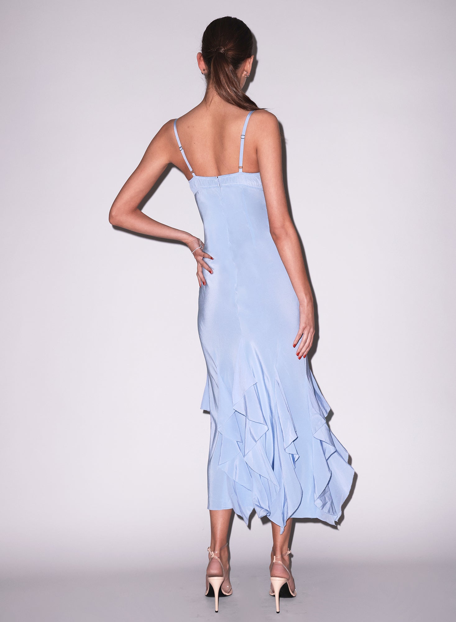 Model wearing a light blue dress with floral embroidery, Eden Gown