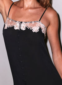 Black slip dress with white lace trim